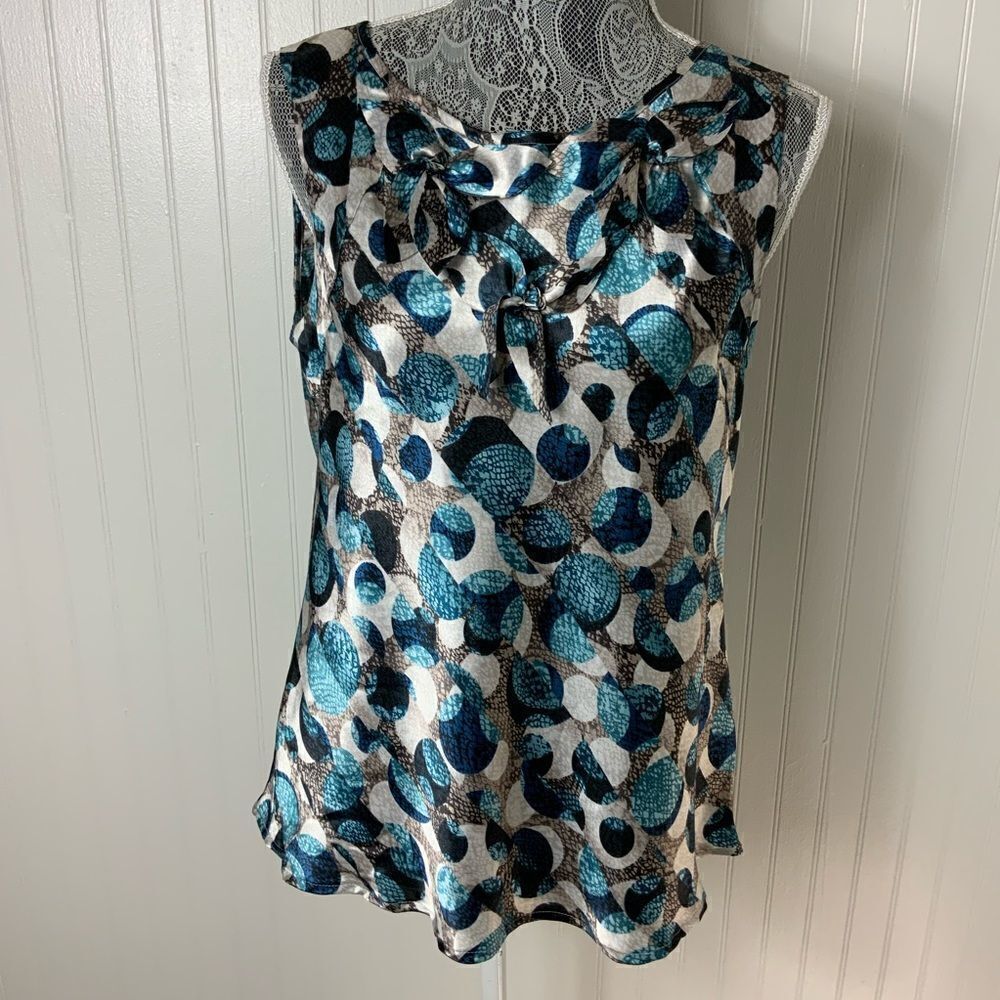 Quintessential sleeveless satin blouse